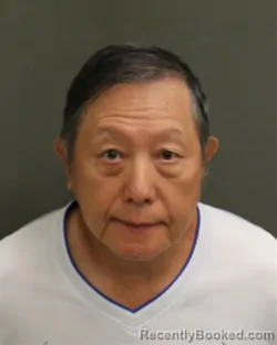 Mugshot of LOUIS SOOSUN HUANG booked in Orange County, Florida on April 18, 2026