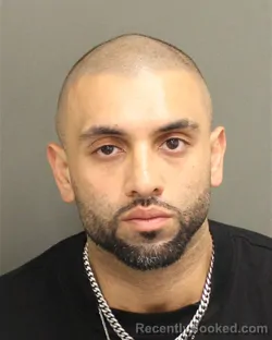 Mugshot of MUHAMMAD SHERYAR KHAN booked in Orange County, Florida on April 19, 2026