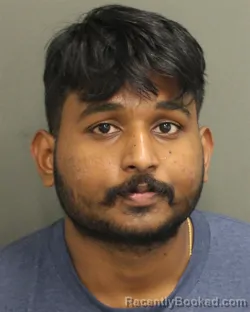 Mugshot of VIGNESH AKASH REDDY DEPURU booked in Orange County, Florida on April 24, 2026