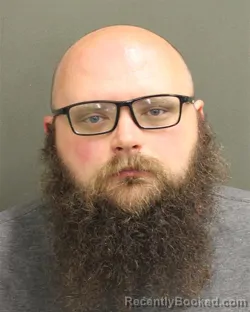 Mugshot of CHRISTOPHER WILLIAM EUGE WILLOUGHBY booked in Orange County, Florida on April 28, 2026