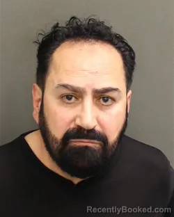 Mugshot of BASEL RADI ALKOWNI booked in Orange County, Florida on April 28, 2026