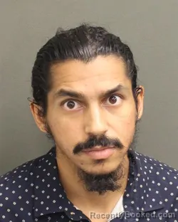 Mugshot of KEVIN ALEXIS CRUZ booked in Orange County, Florida on May 7, 2026