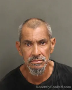 Mugshot of JUAN B ALMANZAR GONZALEZ booked in Orange County, Florida on May 11, 2026
