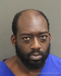 Mugshot of OLUWAKUNLE OLUWADARA ADULOJU booked in Orange County, Florida on May 13, 2026