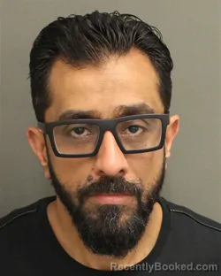 Mugshot of MOHAMED AMIN OMAR MO ZARANDAH booked in Orange County, Florida on May 13, 2026