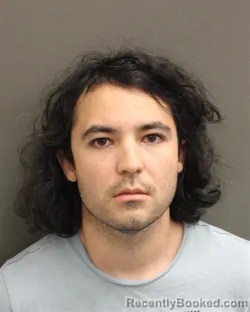 Mugshot of NICOLAS SEBASTIAN ESPARZA booked in Orange County, Florida on May 13, 2026