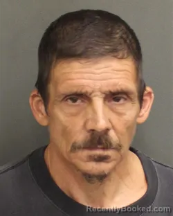 Mugshot of DENNIS MICHAEL MOLENDA booked in Orange County, Florida on May 13, 2026
