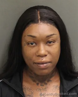 Mugshot of TAIZEYA CHANTERIA TAYLORHARMON booked in Orange County, Florida on May 14, 2026