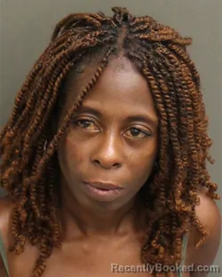 Mugshot of TOMEKA LASHAY CREWS booked in Orange County, Florida on May 14, 2026