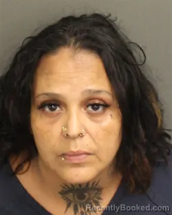 Mugshot of OLGUITA ROSADO booked in Orange County, Florida on May 14, 2026