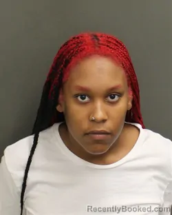 Mugshot of ASHA LENISE RIVERA booked in Orange County, Florida on June 14, 2026