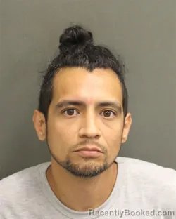 Mugshot of Maximo Arnulfo Flores booked in Orange County, Florida on July 26, 2026