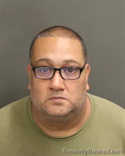Mugshot of Francisco Luis Lopez Cotto booked in Orange County, Florida on July 28, 2026