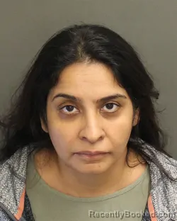 Mugshot of Sharmin Hafeez Ashraff booked in Orange County, Florida on July 29, 2026