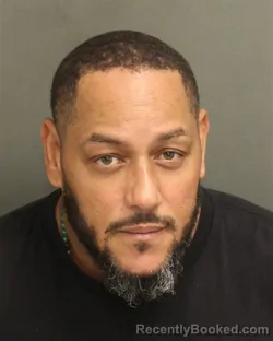 Mugshot of Carlos David Rosario booked in Orange County, Florida on July 30, 2026