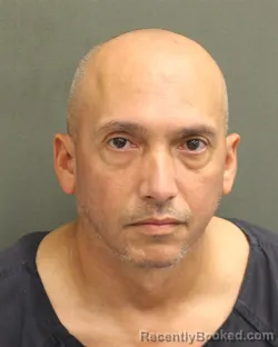 Mugshot of Heriberto Santiago Ruiz booked in Orange County, Florida on August 7, 2026