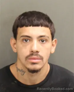 Mugshot of Ozmany Yandel Suarez booked in Orange County, Florida on August 7, 2026