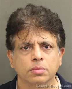 Mugshot of Naveed Ahmad booked in Orange County, Florida on August 9, 2026