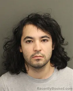 Mugshot of Nicolas Sebastian Esparza booked in Orange County, Florida on August 10, 2026