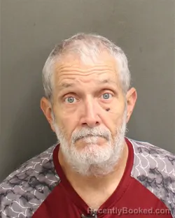 Mugshot of Eric John Rhodes booked in Orange County, Florida on August 11, 2026