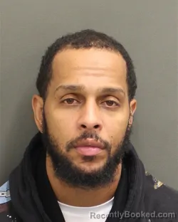 Mugshot of Edwin Jose Cordero booked in Orange County, Florida on August 13, 2026