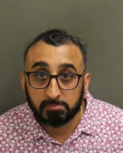 Mugshot of Akshay Bharat Shah booked in Orange County, Florida on August 15, 2026