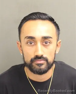 Mugshot of Mayur Vivek Bhatt booked in Orange County, Florida on August 19, 2026