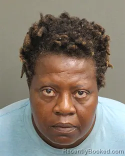 Mugshot of Mildred Solages booked in Orange County, Florida on August 21, 2026