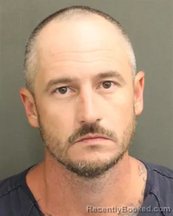 Mugshot of Steven Edward Jr Schneider booked in Orange County, Florida on August 21, 2026