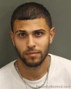 Mugshot of Carlos Yariel Ortizmillan booked in Orange County, Florida on September 13, 2026