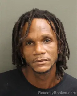 Mugshot of Asim Kwasi John booked in Orange County, Florida on September 20, 2026