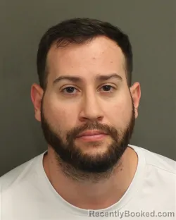 Mugshot of Jonathan Rob Alamia booked in Orange County, Florida on September 27, 2026