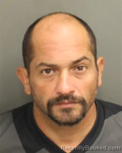Mugshot of Carlos Manuel Ortaperez booked in Orange County, Florida on October 7, 2026