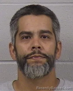Mugshot of Carlos Mario Cotto booked in Dickinson County, Kansas on August 24, 2026
