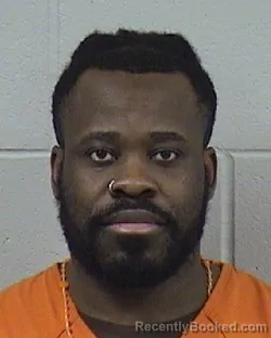 Mugshot of Manfred Adrien Elocka Ngom booked in Dickinson County, Kansas on August 21, 2026