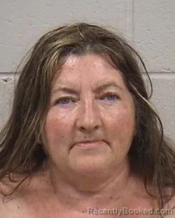 Mugshot of TRACIE LOUISE RATHBUN booked in Dickinson County, Kansas on May 12, 2026