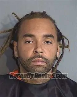 Mugshot of Kelvin Edwin Mena booked in Osceola County, Florida on August 20, 2026