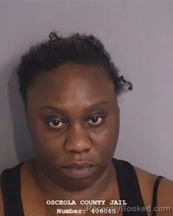 Mugshot of ALVAINA MAGLEASA MOORE booked in Osceola County, Florida on April 24, 2026