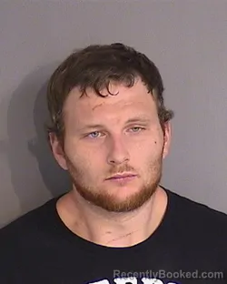 Mugshot of GARRETT PAUL ROSAMOND booked in Osceola County, Florida on May 12, 2026