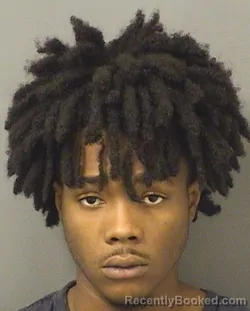 Mugshot of JUSTIN JUNIOR DACCARETT