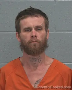 Mugshot of JUSTIN DWAYNE GRANT booked in Pasco County, Florida on March 21, 2026