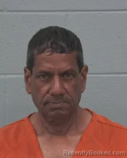 Mugshot of MITRA DHARAM booked in Pasco County, Florida on July 2, 2026