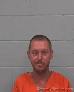 Mugshot of Clarence Carl Brewster booked in Pasco County, Florida on August 23, 2026