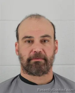 Mugshot of JUSTIN TRAVER HAMERLINCK