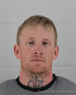 Mugshot of AUSTIN DAVID EARLEY booked in Johnson County, Kansas on March 12, 2026