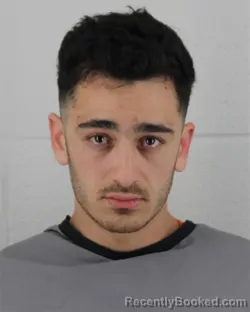 Mugshot of ALI AHMED ALFRAIH booked in Johnson County, Kansas on March 13, 2026