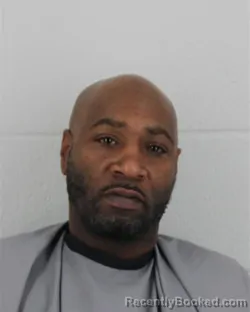 Mugshot of AARON DURON LEWIS booked in Johnson County, Kansas on March 14, 2026