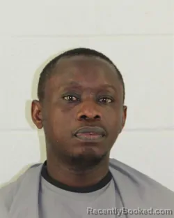 Mugshot of AHADI DEGAUL MWENDA booked in Johnson County, Kansas on March 14, 2026