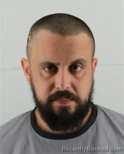 Mugshot of YOUNES CHERGUI booked in Johnson County, Kansas on March 16, 2026