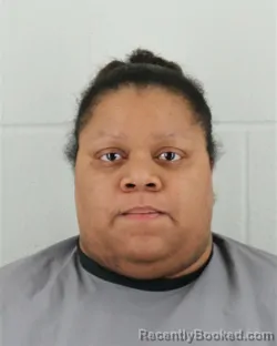 Mugshot of ALEXUS LEACH RHONE booked in Johnson County, Kansas on March 16, 2026